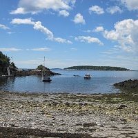 Sand Cove, near South Bristol, Maine. The Habitat Mooring is under the white float that is to the right of the lobster boat in the center of the picture. Chris and crew were able to swim out to the mooring from shore, towing their collection gear in a small raft.
